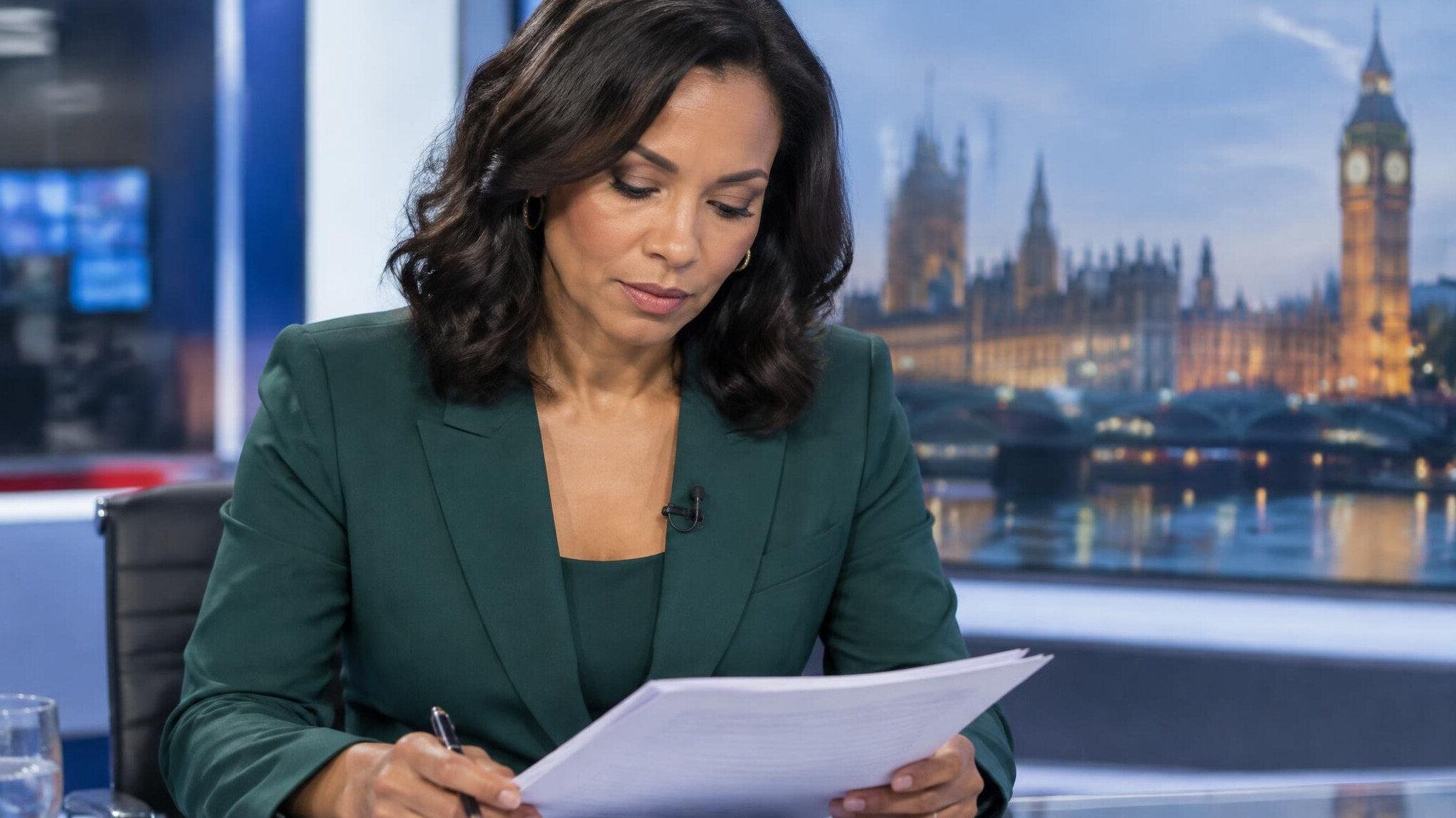 Presenter reading through a morning briefing script